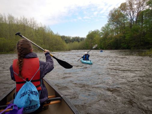 Kayakers paddle down an easy rapid on the Cheat River