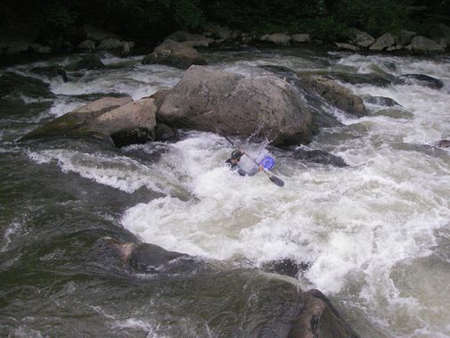 A kayaker drops into an Upper Yough rapid