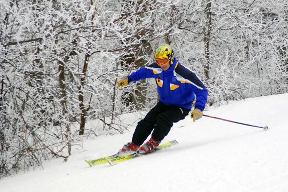A skier tuns down the slope