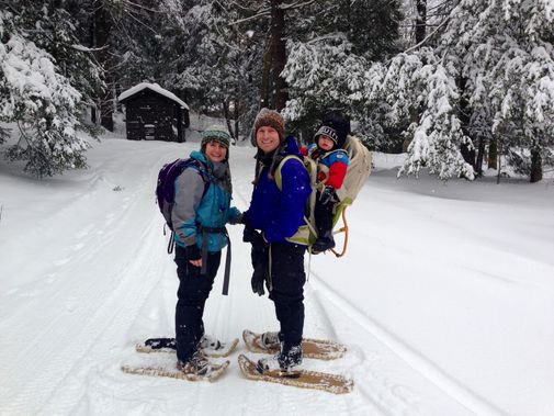 A family getting ready to snowshoe