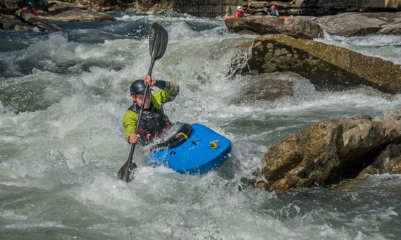 A kayaker paddles through a rapid on the Middle Fork River