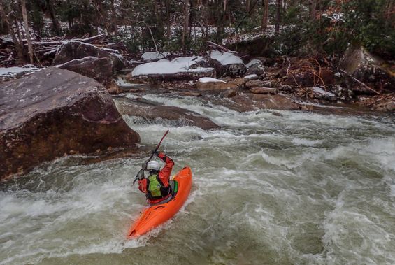 A kayaker paddles through a rapid on the Cranberry River