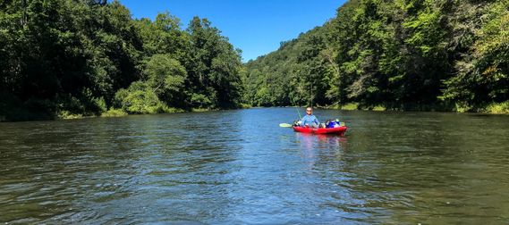 A kayaker floats down the Greenbrier River north of Marlinton