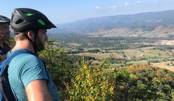 Mountain bikers take a break and gaze at the view from North Fork Mountain