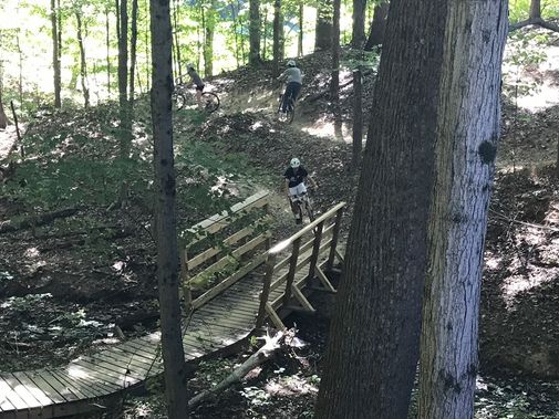 Students learning to mountain bike navigate the turns of the Westover Park trail