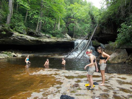 A group takes a dip in a Red Creek hole