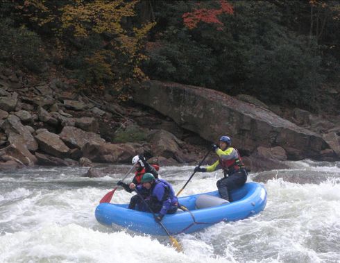 A raft going through Big Nasty Rapid at low water