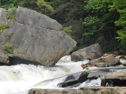 A kayaker makes there way through the entrance to Big Splat falls