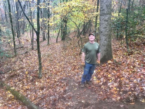 A person hiking at Upshur County Trails