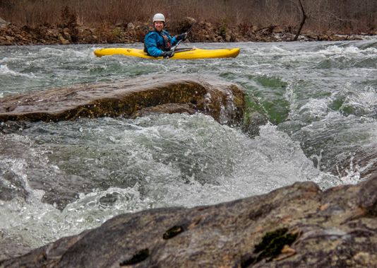 A kayaker prepares to enter a rapid on the Cherry River