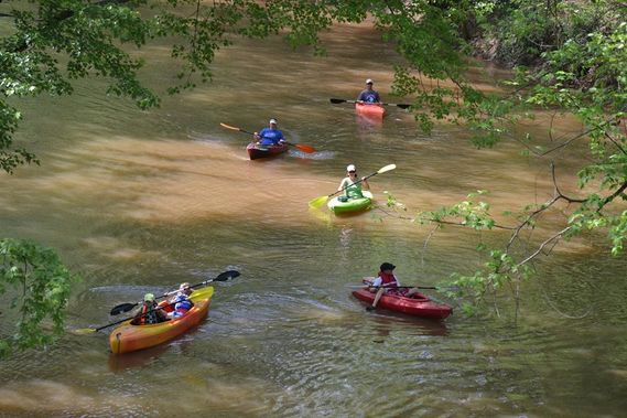 Kayaks float down Mill Creek