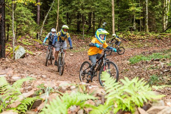 A group of Mountain Bikers make their way down a trail