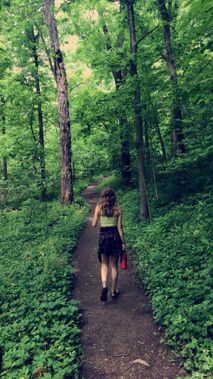 Solo hiking through a lush woodland