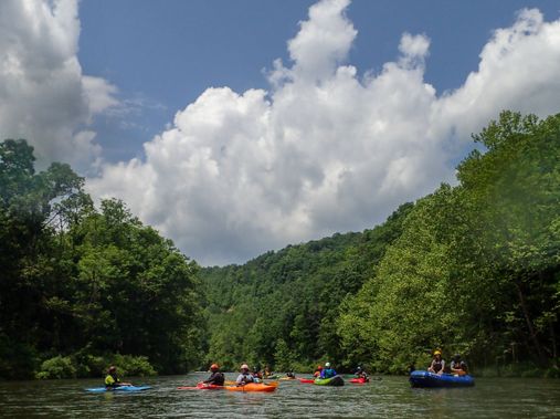 A group of whitewater paddlers float down a calmer section of the North Branch