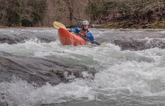 A kayaker paddles through a rapid on the Elk River