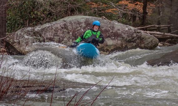 A kayaker paddles through a rapid on the Upper Meadow River