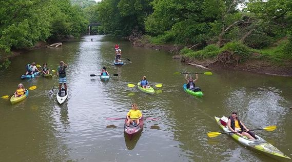 A group of paddlers participates in the Float the Fork trip on the West Fork River Trail