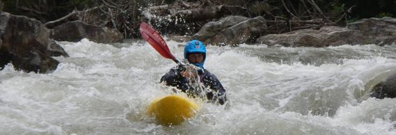 A kayak finishing the first rapid of the Middle Fork River
