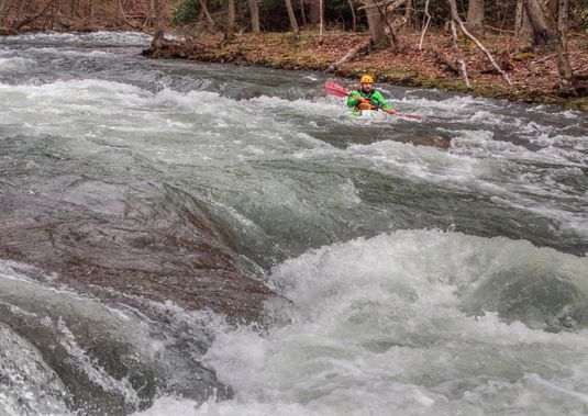 A kayaker paddles through a rapid on the North Branch of the Potomac River