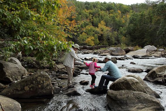 A family plays in the Middle Fork River at Audra SP