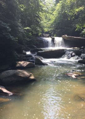 A view of a Deckers Creek waterfall from downstream