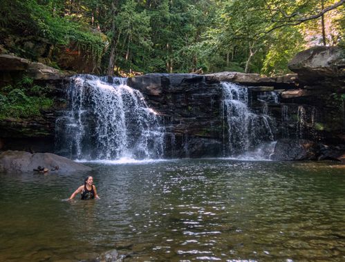 A person swims at Mill Creek Falls