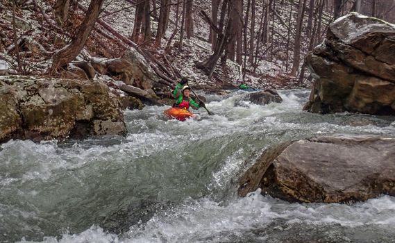 Kayakers paddle down the Savage River