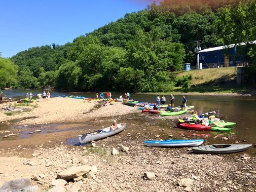 Kayakers prepare to put in on the Elk River near the Sutton Dam