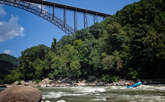 A raft underneath the New River Gorge Bridge