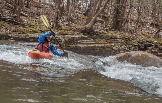 A kayaker paddles through a rapid on the Elk River