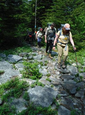 Backpackers hike along Huckleberry Trail in Seneca Creek Backcountry