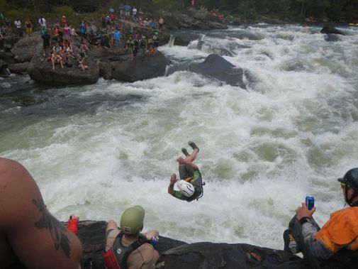 A person flips off Pillow Rock on the Upper Gauley