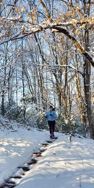 A person running in the winter at Upshur County Trails