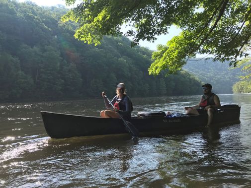 Canoeing along he shore of Cheat River