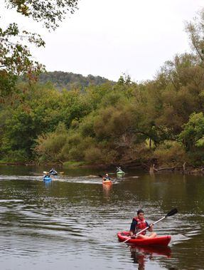Kayakers float down the Elk River
