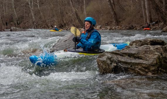 A kayaker paddles through a rapid on the Cherry River