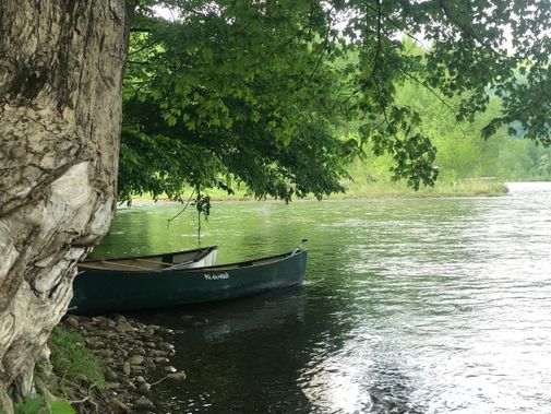 Two canoes on the shore of one of the Seven Islands on the Cheat River