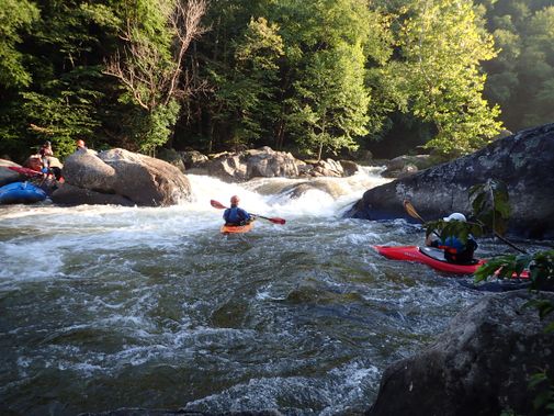 Kayakers wait in a pool below an Upper Yough rapid