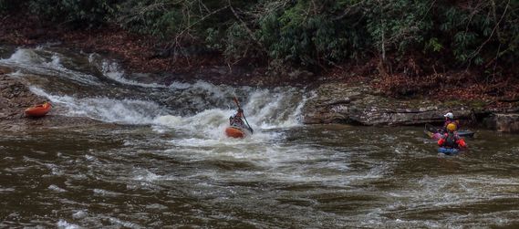 A kayaker makes it through a rapid on the North Fork of the Cherry River 