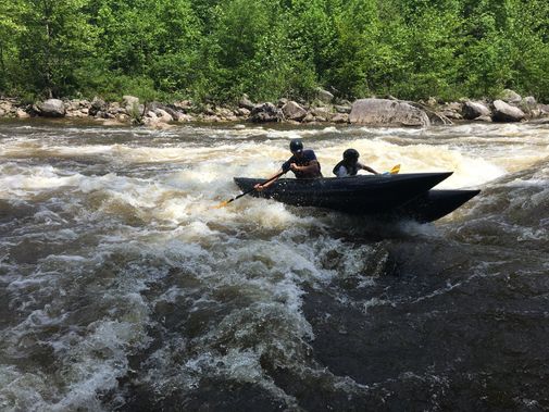 A shredder pushes through a rapid on the Dry Fork River