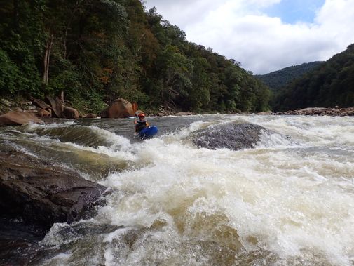 A kayaker enters a rapid on the Cheat Canyon