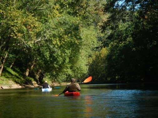 Two kayakers paddle down the Little Kanawha River