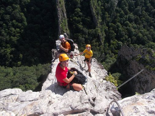 Climbers take a rest and gaze out on the view from the Via Ferrata  at Nelson's Rocks