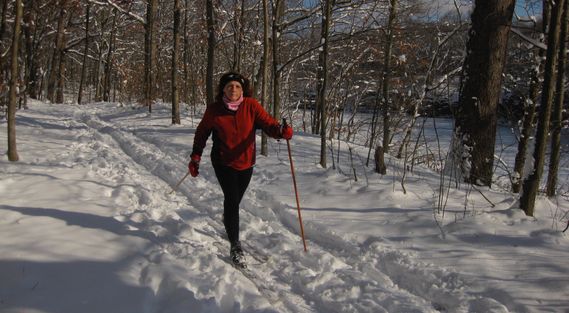 A woman cross country skiing in White Park
