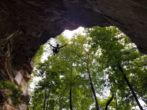 A silhouette of a climber at Summersville Lake